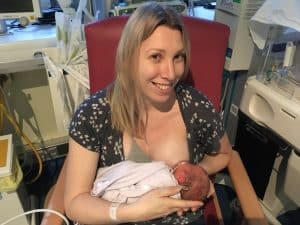 Emma Reed Breast-feeding her baby 